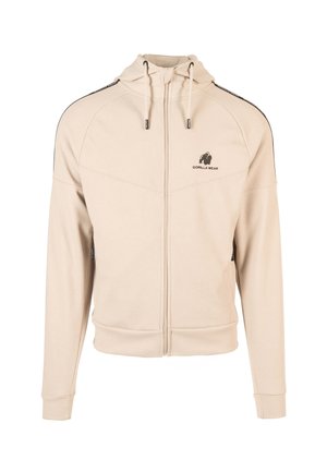 Beige zip-up hoodie van textiel met een aansluitend ontwerp. Voorzien van een capuchon, zwarte zijaccenten en een klein logo op de borst.