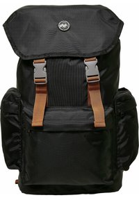 Sac à dos noir avec un rabat supérieur replié, des sangles et des éléments en métal bruns, plusieurs poches et une finition en tissu texturé. Logo au centre en haut.