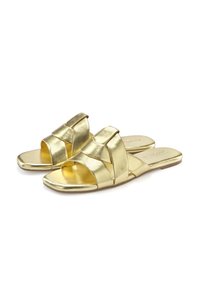 Gold metallic open-toe sandals featuring a crisscross strap design, flat sole, and smooth texture. Suitable for casual wear.