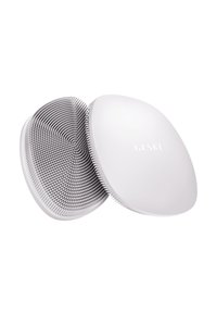 Appareil portable blanc avec un extérieur lisse et arrondi. L'intérieur présente des poils texturés en spirale pour un nettoyage ou un toilettage efficace.
