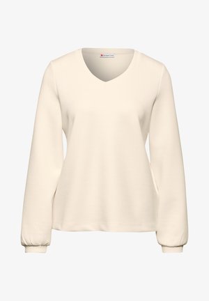 Beige V-hals sweatshirt met lange, verzamelde mouwen; zachte stof; eenvoudig ontwerp; geen zichtbare patronen of accenten.