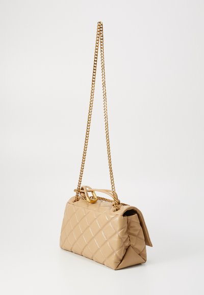 Quilted beige handbag with a chain strap and gold hardware. Features a rectangular shape and textured surface with diamond patterns.