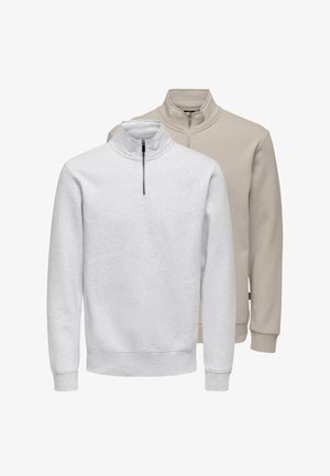 Twee longsleeve pullover: één in heidegrijs met een ritskraag, en één in effen beige met een klassieke pasvorm en geribde manchetten.