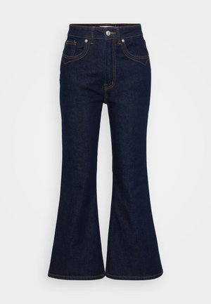 Mørkeblå denim flared jeans med høy midje, fem lommer, synlig søm, og knappelukking foran.