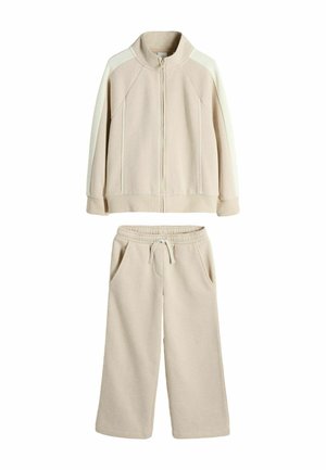 Trening bej din fleece cu geacă cu fermoar pe toată lungimea, cu dungi contrastante pe umeri și pantaloni largi asortați cu talie cu șnur și buzunare.