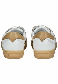 White leather sneakers with tan accents, contrasting textures, and rubber soles. Features a scalloped design on the back.
