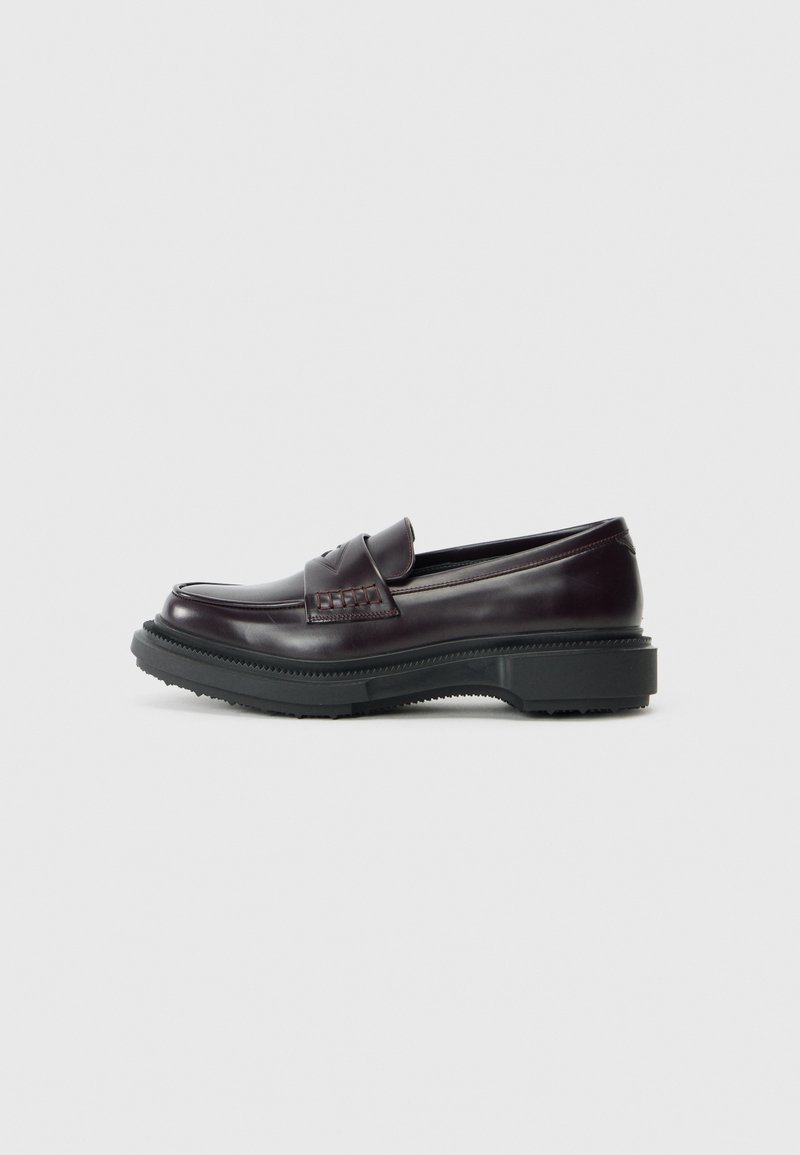 Dark burgundy leather loafers with a smooth finish, featuring a decorative stitched panel, a rounded toe, and a thick black rubber sole.