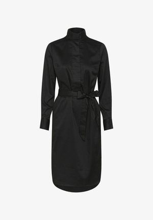 Juoda ilgomis rankovėmis suknelė su aukštu apykakliu, priekyje mygtukų uždarymas ir stilinga diržo juosta juosmenyje. Sklandus, lengvas audinys.