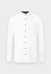 Chemise blanche à manches longues avec un col standard. Présentant des boutons bleu marine et un col intérieur contrastant. Tissu en coton lisse.