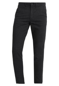 Musta, kapealahkeiset housut, jotka on valmistettu teksturoidusta kankaasta. Housuissa on tavallinen vyötärökaitale, vyölenkit ja etutaskut.