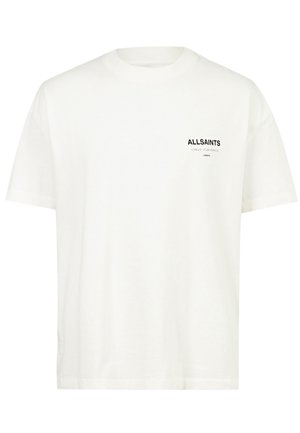 T-shirt blanc en coton à manches courtes. Présente un logo noir sur la poitrine gauche. Coupe droite avec un col rond.