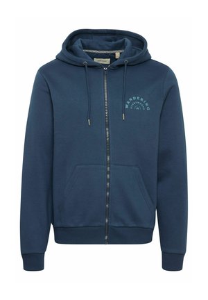 Navy modra zip-up kapuca iz mehkega blaga, ki ima kenguru žep, kapuco z vrvico in grafikami "WANDERING" na prsih.