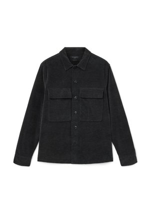 Black corduroy shirt with long sleeves, button-down front, and two chest pockets. Features a classic collar and textured fabric.