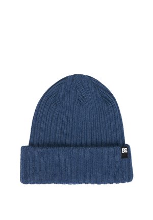 Blue knitted beanie with folded cuff and small black and white logo tag on the side against a white background.