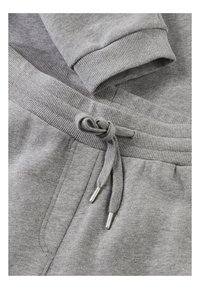 Grijze katoenen sweatshirtstof met geribbelde manchetten en tailleband, voorzien van een trekkoord met zilveren metalen aglets voor aanpassing.