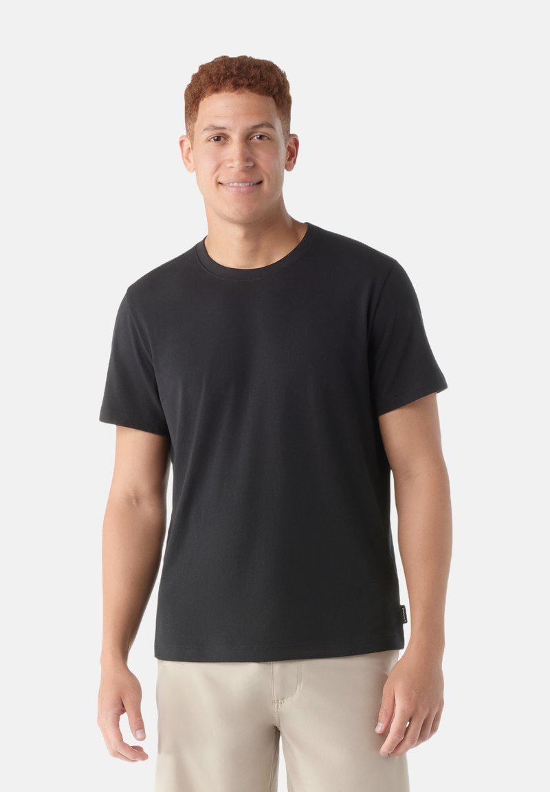Black short-sleeve t-shirt in a relaxed fit, made of soft cotton fabric, featuring a classic crew neck design with a smooth texture.