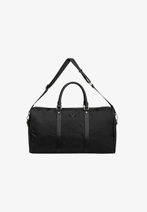 Sac de sport noir en tissu résistant, avec des accents en cuir, des poignées supérieures doubles et une bandoulière amovible et réglable.