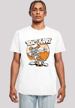 White cotton t-shirt featuring a graphic design of Tom and Jerry in gray, orange, and black, with playful elements and text.