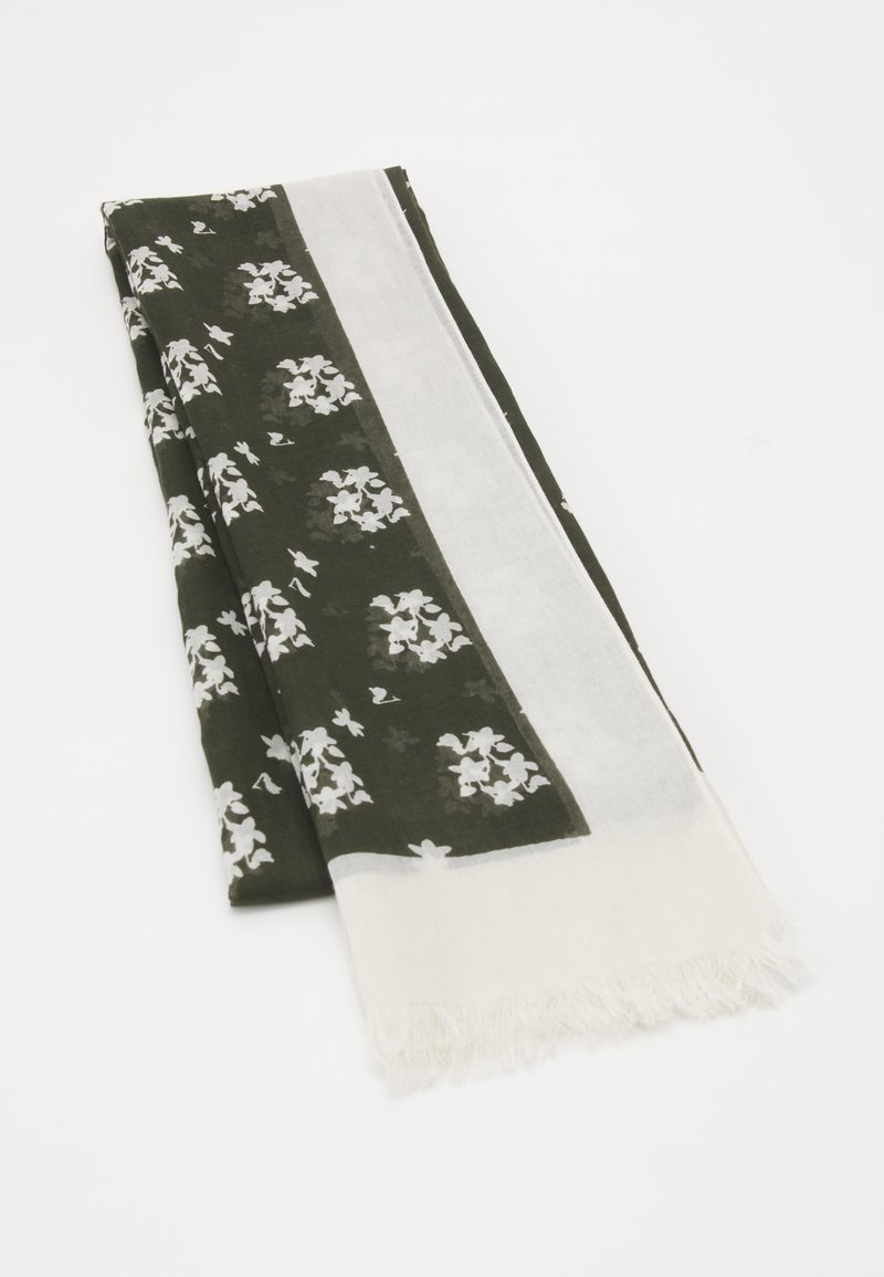 Écharpe vert foncé pliée avec des motifs floraux blancs et une bordure blanche unie avec des bords à franges.