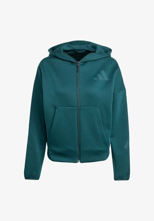 Groene rits-houthie van zachte stof. Kenmerken zijn een voorkant vak, een capuchon en een klein logo op de borst. Soepele textuur en een relaxte pasvorm.