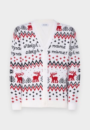 White knitted cardigan with red and black zigzag, reindeer, tree patterns, and "sleigh my name" text, featuring a V-neck and button closure.