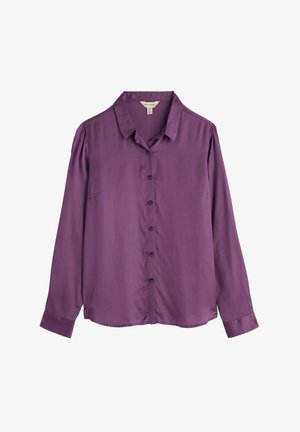 Blusa morada de manga larga con cuello y cierre de botones. Fabricada con una tela suave, tiene un ajuste ligeramente relajado y mangas con puños.