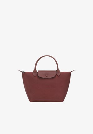 Brown tote bag with two handles, a front flap with button closure, and a zipper at the top against a white background.