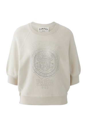 Beige sweatshirt met korte mouwen, een geribbelde kraag en zoom, met "UNIVERSITY PARIS" en een decoratief wapenontwerp aan de voorkant.