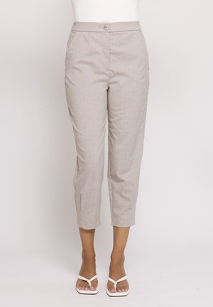 Beige cropped slim-fit pants with subtle pinstripes, button closure, worn with white open-toe sandals on a white background.