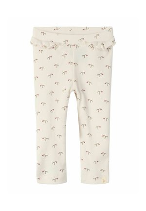 Kremowe niemowlęce spodnie w prążki z małym różowym kwiatowym wzorem i falbaniastym wykończeniem w talii.