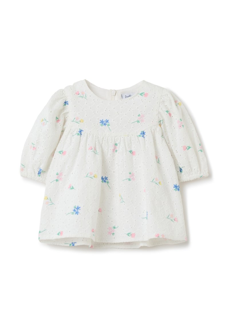 Blusa bianca per bambini con maniche a sbuffo, stampa floreale nei toni del rosa e blu, tessuto strutturato, scollatura rotonda e chiusura con zip sul retro.