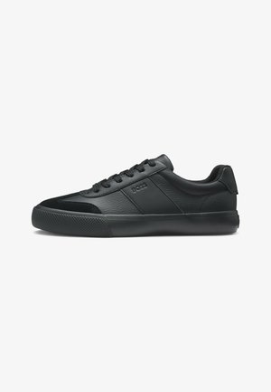 Black low-top leather sneaker with textured rubber sole, black laces, and embossed "BOSS" logo on side panel.