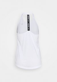 White Nike tank top with black vertical strap featuring "NIKE" and the swoosh logo, racerback style, displayed on a plain background.