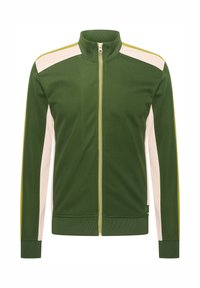 Chaqueta verde con cremallera y cuello alto, que presenta paneles laterales crema y acentos amarillos. Hecha de tejido texturizado, cuenta con puños de canalé.