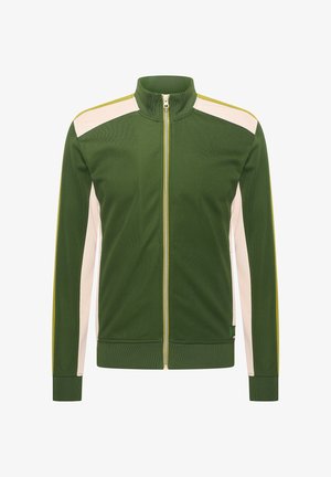 Veste zippée verte avec un col haut, présentant des panneaux latéraux crème et des accents jaunes. Fabriquée en tissu texturé, elle possède des poignets côtelés.