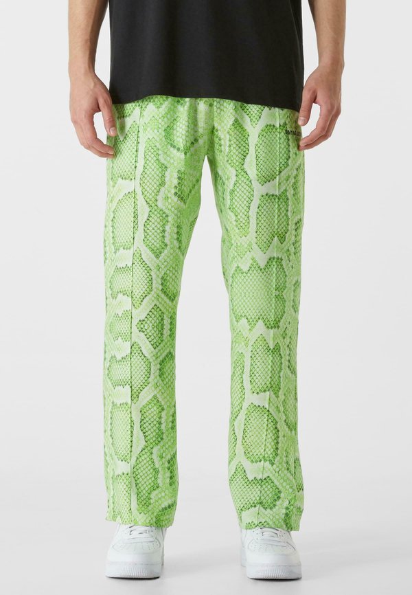 ALL OVER SNAKE - Stoffhose