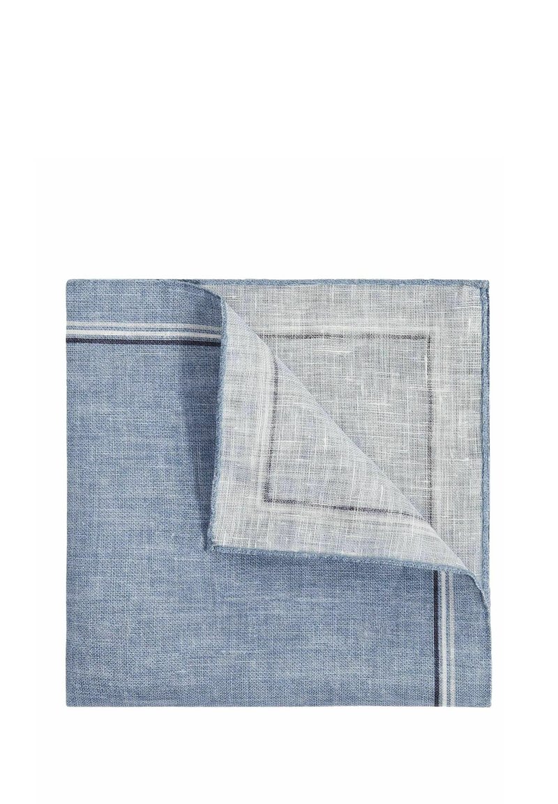 Blue linen tablecloth with a folded corner revealing a textured white fabric underneath. Features a subtle striped border.