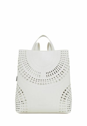 White leather backpack with cut-out designs, two top handles, and a smooth texture. Features a rounded top and a zip closure.