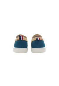 Blue suede slip-on shoes with cream accents, featuring a white rubber sole and small red, white, and blue stripes on the heel.