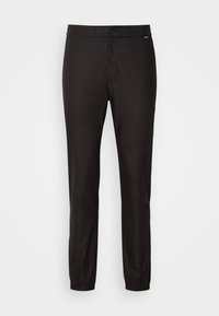 TAPERED - Trousers - black