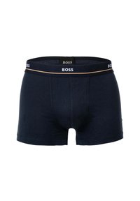 Boxers en coton bleu marine avec un design ajusté, présentant une taille étiquetée "BOSS" et une bande d'accent d'une couleur plus claire.
