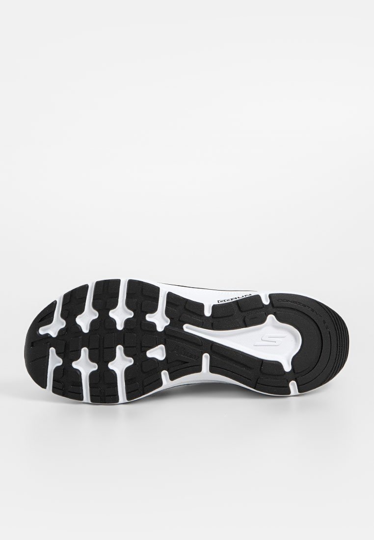 Suela de zapato de goma negra con mediopie blanco. Presenta un dibujo de banda para agarre y un logotipo en relieve. Acabado suave con diseño contorneado.