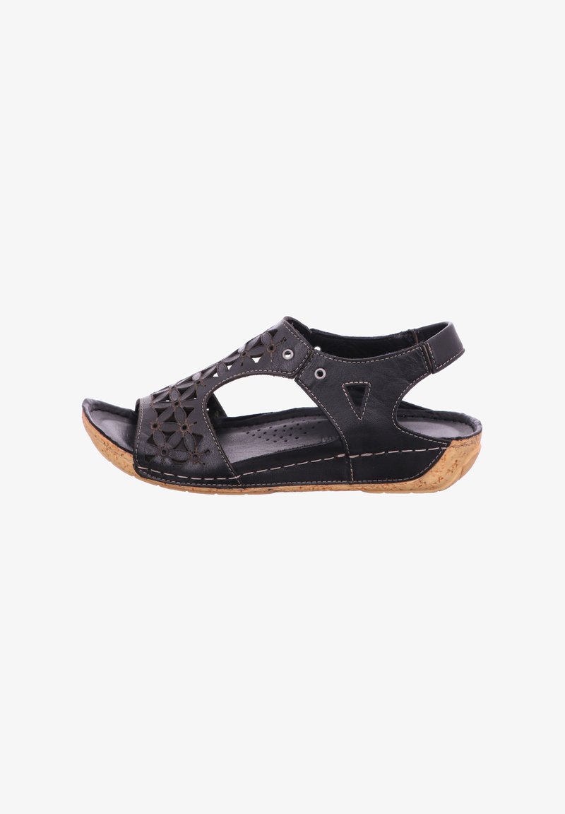 Black leather sandal with cutout floral design, cork sole, and adjustable back strap. Features stitching accents and perforated insole.