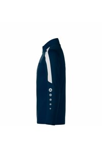 Maglietta a maniche lunghe blu navy con dettagli in pannelli bianchi, colletto e accenti grigi sui bottoni delle maniche. Realizzata in un tessuto liscio ed elasticizzato.