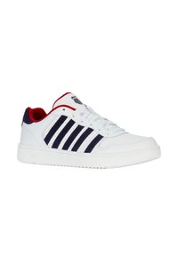 White sneaker featuring navy stripes and red accents, constructed from synthetic material, with a textured rubber sole and classic lace closure.