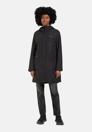 Black, long-sleeve parka with a zip front, adjustable hood, and oversized pockets. Soft fabric with a smooth texture; minimalist design.