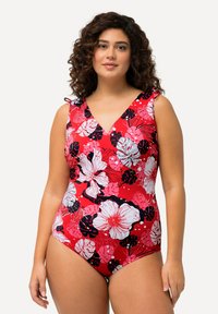 Rode bloemen badpak met V-hals, voorzien van roze en witte tropische bloemenpatronen en schouderbanden. Zachte, rekbare stof.