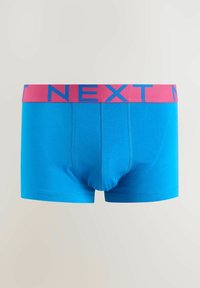 Blue men's boxer briefs with a pink waistband featuring the word "NEXT" in large blue letters on a plain white background.