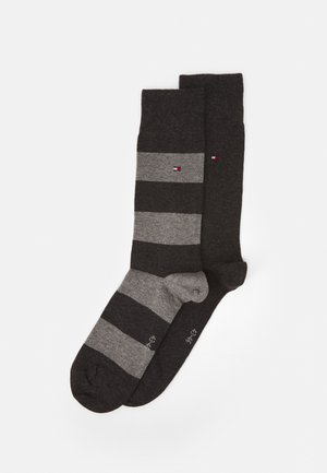 Two pairs of socks; one solid dark gray, the other striped in dark and light gray. Made of soft fabric with reinforced toe and heel.