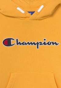 Champion Rochester LOGO HOODED UNISEX - Mikina s kapucí - yellow